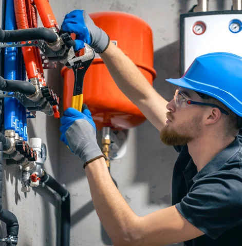 Plumber performing backflow prevention system maintenance – Plumber Pro Dallas