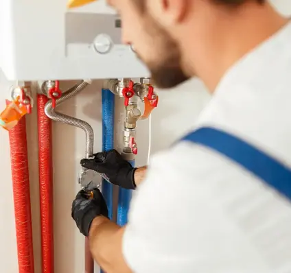 Worker Installing heating system - Plumber Pro Dallas
