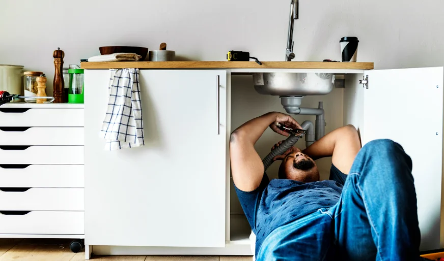 Plumber cleaning kitchen drain and piping – Plumber Pro Dallas