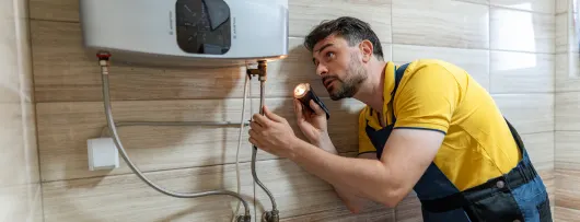 Plumber inspecting water heater connections – Plumber Pro Dallas